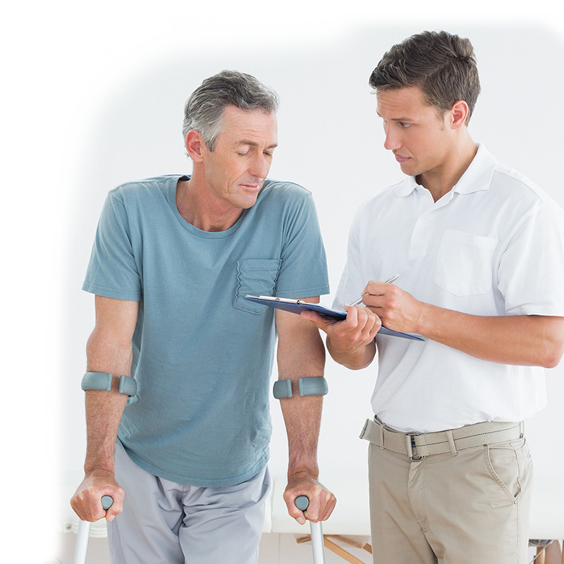 Rehab therapist with a resident in the rehab gym